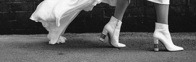 A woman's legs mid stride wearing Freya Rose Bridal Boots