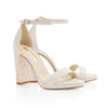 Product image of side view of 'Dove' by Freya Rose London - An ivory leather bridal shoe with pearl heel
