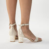 A model wearing 'Martene Midi' Bridal womens shoe with pearl heel by Freya Rose Pearl Shoes and Jewellery