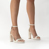 Model wearing 'Dove' by Freya Rose London - An ivory leather bridal shoe with pearl heel