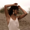 Campaign image of woman wearing elegant Mother of Pearl and Pearl Drop Earrings | Freya Rose