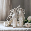 A product shot of 'Flora' - Ivory Shimmering Suede & Champagne Mirrored Leather Sandal Bridal Shoes by Freya Rose London