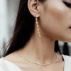The 'Oval Crystal Framed Necklace' worn on a model by Freya Rose London
