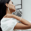 Silver Baroque Pearl Long Drop Earrings worn by a model- Freya Rose Pearl Jewellery
