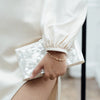 The Oval Crystal Framed Bracelet worn by a model by Freya Rose London