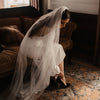 A bride wearing 'Micola Noi' A Freya Rose Black Suede Designer Bridal Shoe