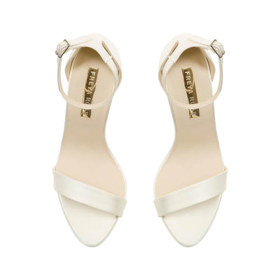 A pair of Freya Rose Ivory Satin Bridal Shoes