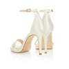 A pair of Freya Rose Ivory Satin Bridal Shoes
