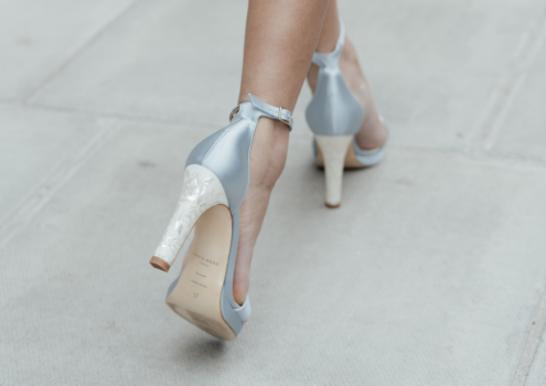 Women walking in beautiful something blue wedding shoes with mother of pearl heels