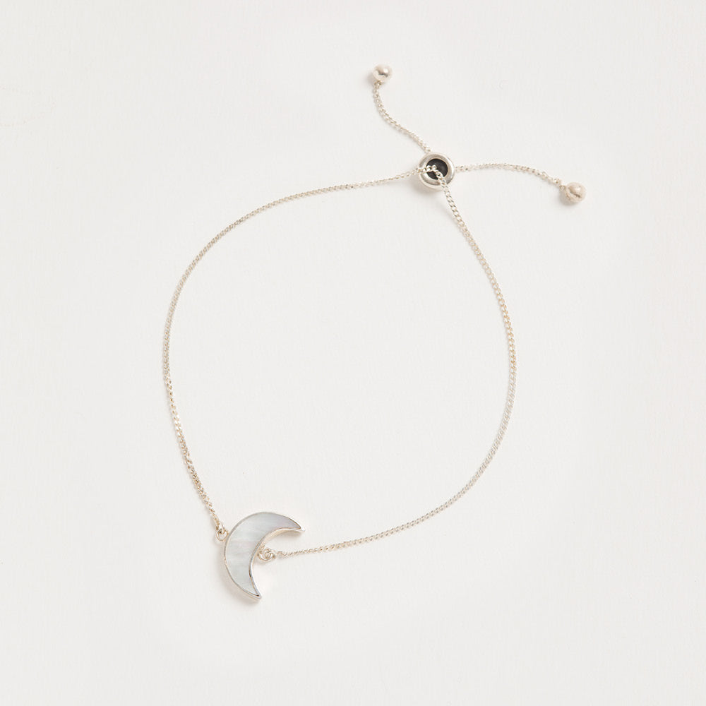 A product shot of 'Adjustable Silver Moon Bracelet' Designer Mother of Pearl Jewellery by Freya Rose London