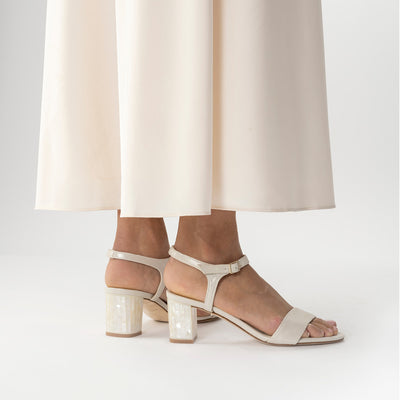 Martina Midi Ivory worn by a model - A shimmer suede mid-heel bridal shoe with Pearl Heels