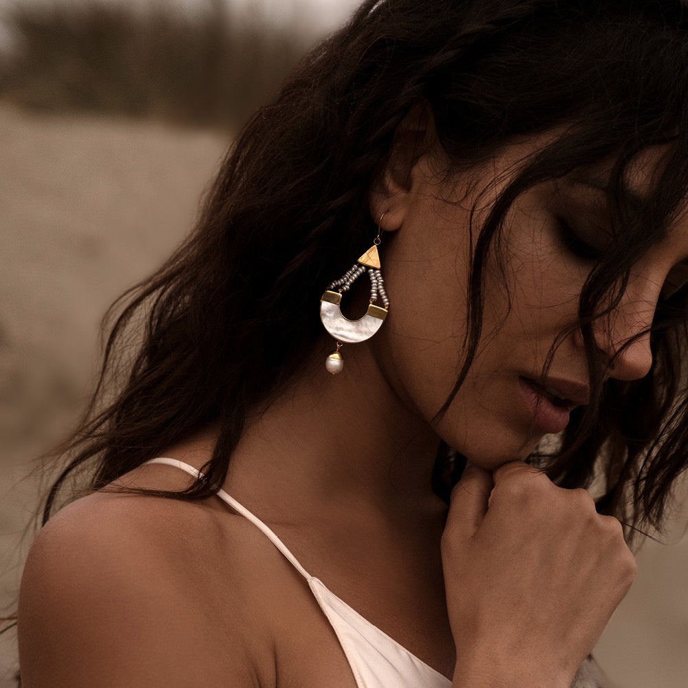 Campaign image of woman wearing feminine Mother of Pearl and Pearl Drop Earrings | Freya Rose