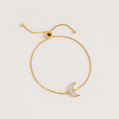 A product shot of 'Adjustable Gold Moon Bracelet' Designer Mother of Pearl Jewellery by Freya Rose London