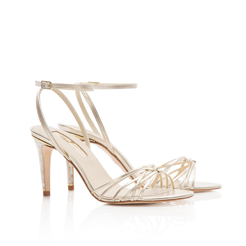 Product image of the 'Bella' Shoe from Freya Rose London. Bella is a luxurious champagne leather sandal featuring the Freya Rose signature jewelled pearl heels