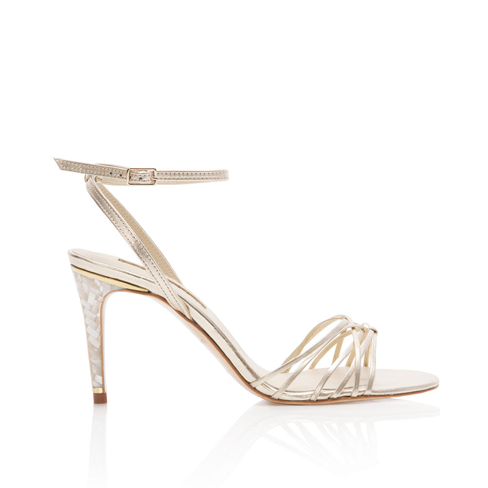 Product image of the 'Bella' Shoe from Freya Rose London. Bella is a luxurious champagne leather sandal featuring the Freya Rose signature jewelled pearl heels