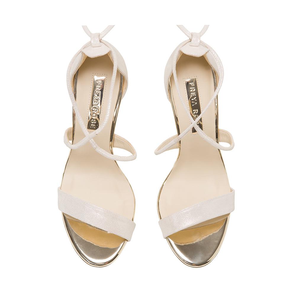 A product shot of 'Flora' - Ivory Shimmering Suede & Champagne Mirrored Leather Sandal Bridal Shoes by Freya Rose London 