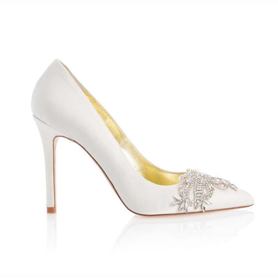 A side shot of a Freya Rose Bridal Court Shoe - 'Celina Ivory' Is an Ivory satin court shoe with a crystal embellishment over the toe.