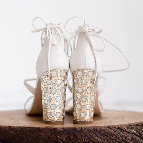 A pair of Freya Rose White Leather Designer Shoes